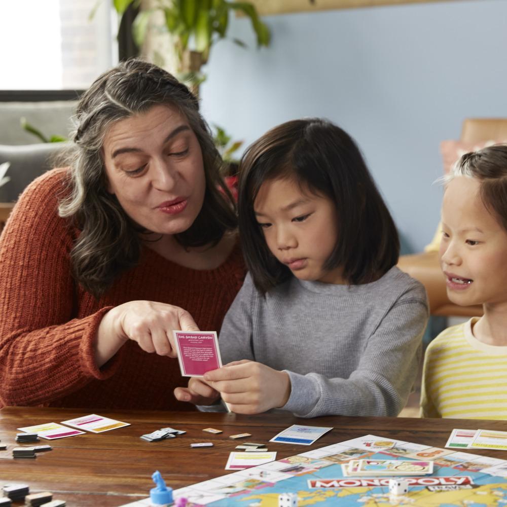 Monopoly Travel World Tour Board Game for Families and Kids Ages 8+, Includes Token Stampers and Dry-Erase Gameboard product thumbnail 1